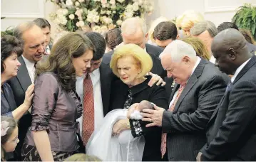  ?? THE ASSOCIATED PRESS ?? Word of Faith Fellowship leader Jane Whaley, centre, seen with her husband, Sam, at a ceremony in the church’s compound in Spindale, N.C., is at the heart of accusation­s of abuse at her church that includes beatings and threats.