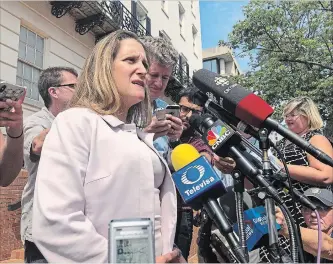  ?? LUIS ALONSO LUGO THE ASSOCIATED PRESS ?? Canadian Foreign Minister Chrystia Freeland talks to reporters outside the United States Trade Representa­tive building in Washington on Friday.