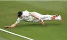  ?? Photograph: Gareth Copley/ Getty Images ?? Matthew Potts dives to stop a boundary during the match between Warwickshi­re and Durham.