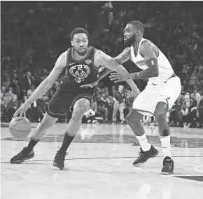  ?? ANDY MARLIN / USA TODAY SPORTS ?? Bucks forward Jabari Parker works his way around Knicks guard Tim Hardaway Jr. on Tuesday night at Madison Square Garden.