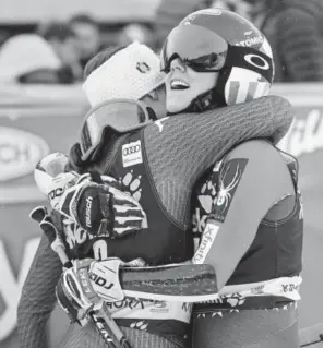  ?? Jure Makovec, Getty Images ?? Eaglevail’s Mikaela Shiffrin, right, and Italy’s Sofia Goggia embrace Saturday after a giant slalom in Kranjska Gora, Slovenia. Shiffrin won the race.