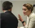  ?? ?? Actress Amber Heard talks to her attorney in the courtroom at the Fairfax County Circuit Courthouse in Fairfax, Virginia.