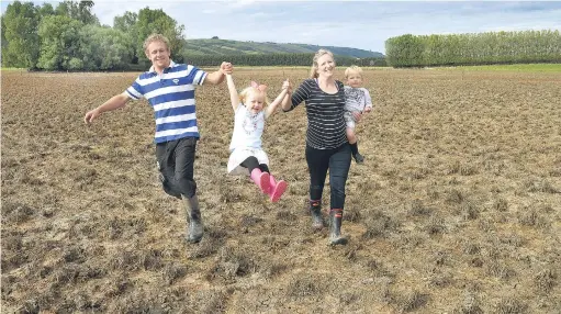  ?? PHOTO: STEPHEN JAQUIERY ?? Offers of assistance from strangers have buoyed the spirits of Cody, Ella (3), Rosie and Beau (2) Cowley on their floodaffec­ted Taieri farm.