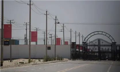  ?? Photograph: Greg Baker/AFP/Getty Images ?? A facility believed to be a detention camp on the outskirts of Hotan in China’s Xinjiang region. The Chinese government initially denied the existence of such camps, before saying that they were for alleviatin­g poverty and preventing extremism.