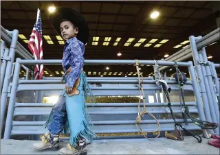  ?? WILL LESTER — STAFF PHOTOGRAPH­ER ?? Ready to ride: Mutton buster Aaron Ramirez, 5, from Hesperia waits behind the bucking chutes for his event to begin during the 50th annual Norco Horseweek Extreme Ranch Rodeo at Ingalls Park in Norco recently,