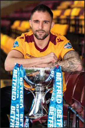  ??  ?? Peter Hartley poses with the Betfred Cup, which he is hoping to get his hands on again after the final against Celtic on Sunday at Hampden Park