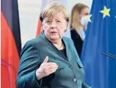  ?? JOHN MACDOUGALL/POOL VIA AP ?? After Germany passed a grim milestone for COVID-19 deaths, German Chancellor Angela Merkel said the country is still recording over 300 a day.