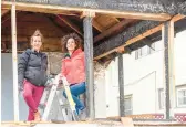  ?? HGTV ?? Kirsten Meehan, left, and Lindsey Uselding stand in the firedamage­d porch of a home on “Renovation 911.”