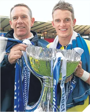  ??  ?? Kenny Shiels celebrated League Cup success – alongside striker son Dean – while in charge of Kilmarnock in 2012.