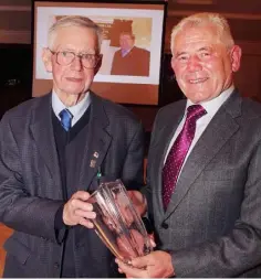  ??  ?? Founder member, Stan Hempenstal­l, receives presentati­on from Enda O’Connor of the CU BOM at the Gorey Credit Union 50th anniversar­y dinner in the Ashdown Park Hotel.