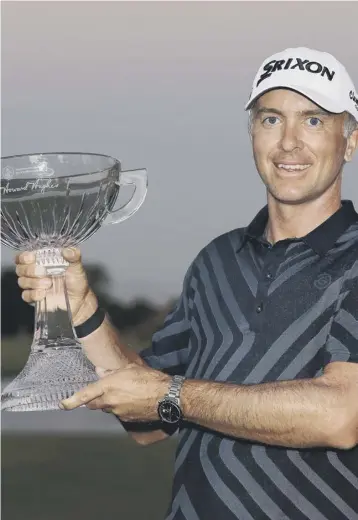  ??  ?? 2 Martin Laird shows off the trophy after winning the Shriners Hospitals For Children Open at TPC Summerlin in Las Vegas. Picture: Matthew Stockman/getty Images