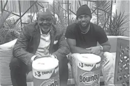  ?? JOSE M. ROMERO ?? Hall of Famer Emmitt Smith and his son E.J. are in town for Super Bowl 57, appearing on behalf of Bounty paper towels.