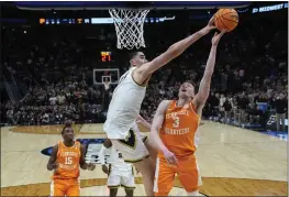  ?? PAUL SANCYA — THE ASSOCIATED PRESS ?? Purdue center Zach Edey (15) blocks a basket attempt by Tennessee guard Dalton Knecht (3) during the second half of an Elite Eight game in the NCAA Tournament on Sunday in Detroit.