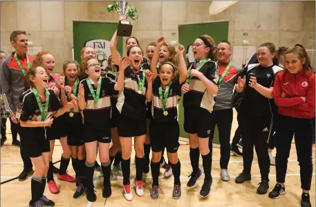  ??  ?? St. Attracta’s Community School captain Jessica Casey lifting the cup after the Post-Primary Schools National Futsal Final at Waterford IT Sports Arena. Pic: Eóin Noonan/Sportsfile.