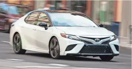  ?? TOYOTA VIA AP ?? The 2018 Toyota Camry, one of the most popular midsize sedans sold in America, has been completely redesigned with better handling and improved fuel economy.