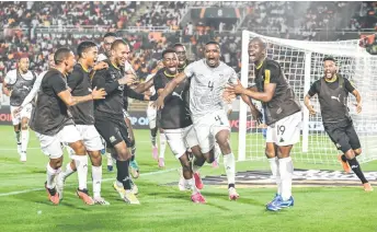  ?? — AFP photo ?? South Africa’s Teboho Mokoena (centre) celebrates with teammates after scoring a goal during the Africa Cup of Nations round of 16 match against Morocco at the Stade Laurent Pokou in San Pedro.