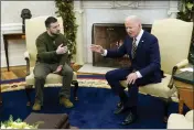  ?? PATRICK SEMANSKY — THE ASSOCIATED PRESS FILE ?? President Joe Biden speaks with Ukrainian President Volodymyr Zelenskyy as they meet in the Oval Office of the White House on Dec. 21 in Washington.