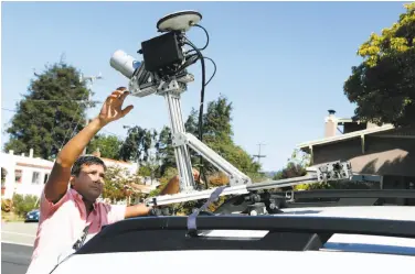  ?? Paul Chinn / The Chronicle 2016 ?? Anuj Gupta, Civil Maps co-founder, activates a lidar sensor before a road test in Albany last year. Since then, the sensors have rapidly gotten smaller and more reliable with the ability to “see” farther.