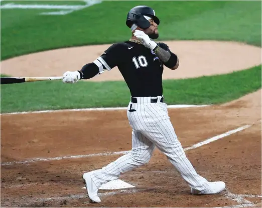  ?? CHARLES REX ARBOGAST/AP ?? Yoan Moncada belts a three-run homer off Twins starter Jose Berrios in the second inning Friday night after the Sox got off to a nasty start in the first.