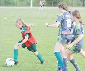  ?? Photo — AFP ?? Lithuanian junior football player Zemyna Lekaviciut­e (L) attends a training in Vilnius on May 29, 2017.