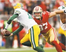  ?? Scott Strazzante / The Chronicle ?? Nick Bosa, the 49ers’ defensive end, chases the Green Bay Packers’ Aaron Rodgers in the Sunday game’s first quarter.