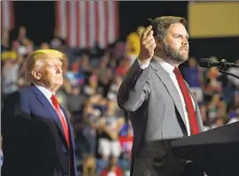  ?? Jeff Swensen Getty Images ?? J.D. VANCE, with former President Trump last month at a rally in Youngstown, Ohio, has stressed cultural issues to try to counter his rival’s economic message.