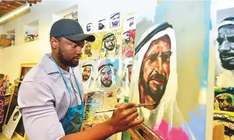  ?? Clint Egbert/Gulf News ?? Hearing and speech impaired Zambian artist Victor Sitali’s portraits of UAE Rulers will be featured in three exhibition­s.