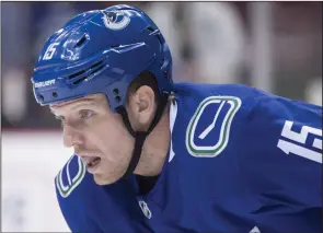  ?? CP PHOTO DARRYL DYCK ?? Vancouver Canucks' Derek Dorsett lines up for a face-off during the first period of an NHL hockey game against the Dallas Stars in Vancouver, B.C., on Monday October 30. Dorsett is ending his hockey career due to spinal issues. The team says doctors...