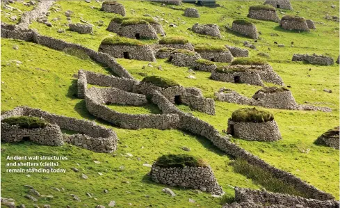  ??  ?? Ancient wall structures and shelters (cleits) remain standing today