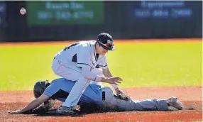  ?? JIM THOMPSON/ASSOCIATED PRESS ?? Cleveland’s Treston Shallenber­ger slides into second safely between the legs of Rio Rancho’s Ethan Silcox, who misses the throw Thursday.