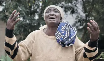  ?? BEN CURTIS/ THE ASSOCIATED PRESS ?? Mary Italo grieves for her son Thomas Abayo Italo, 33, who was killed in the Westgate Mall attack, as she waits to receive his body at the mortuary in Nairobi, Kenya, on Wednesday. Kenyan authoritie­s prepared for the gruesome task of recovering dozens...