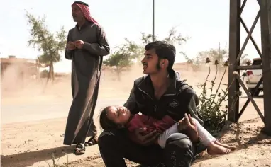  ?? PICTURE: AP ?? REFUGE: A girl sleeps in her father’s arms in western Mosul after fleeing from fighting between Iraqi forces and the Islamic State group.