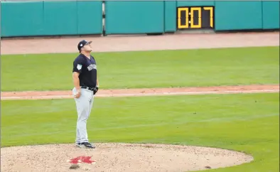  ?? Gerald Herbert / Associated Press ?? Yankees pitcher Cale Coshow prepares to pitch as the pitching clock winds down during a spring training game against the Red Sox in Fort Myers, Fla., on Saturday. The Red Sox won 8-5.