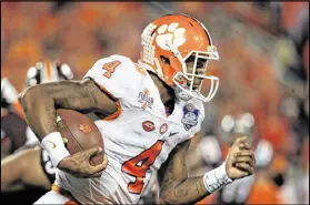  ?? MIKE EHRMANN / GETTY IMAGES ?? Quarterbac­k Deshaun Watson has led Clemson to its second straight berth in the College Football Playoff.