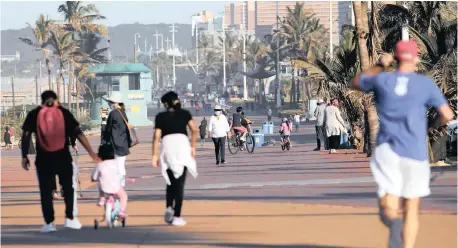  ?? | DOCTOR NGCOBO ?? A BUSY Durban beachfront promenade after the country entered level 3 of the national coronaviru­s lockdown. Judge Norman Davis’s ruling that the lockdown regulation­s were unconstitu­tional is appealable for several reasons, the writer says. African News Agency (ANA)