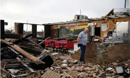  ?? ?? Pat Smith looks through his restaurant, Matador Diner, after a tornado Thursday in Matador, Texas. S Photograph: Annie Rice/AP