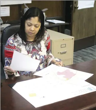  ?? Brodie Johnson • Times-Herald ?? The St. Francis County Clerk’s Office is gearing up for the filing period to begin next month for the May Primary election. SFC County Clerk Brandi McCoy reviews maps of the districts to confirm filing positions.