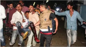  ?? - Reuters/Stringer ?? INJURED: A wounded man is taken to a hospital by local people after a bomb blast in Sylhet, Bangladesh on Saturday.