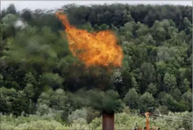  ?? TOBY TALBOT — THE ASSOCIATED PRESS FILE ?? In this file photo, flames from methane burning at the landfill in Coventry, Vt. The Trump administra­tion is delaying two Obama-era regulation­s aimed at restrictin­g harmful methane emissions from oil and gas production.