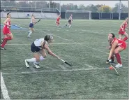  ?? MIKE CABREY/MEDIANEWS GROUP ?? Souderton’s Josie Doughty (6) tries to get a stick on a ball played by North Penn’s Riley O’Donnell (9) during their game on Thursday.