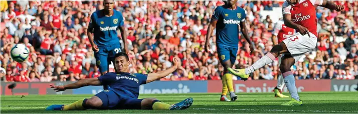  ?? AFP/GETTY IMAGES ?? Finishing touch: Danny Welbeck fires past a despairing Fabian Balbuena to complete Arsenal’s victory over their London rivals in added time