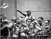  ?? BEBETO MATTHEWS/AP ?? Spectators show support for Puerto Rico on Sunday during the National Puerto Rican Day Parade in New York.