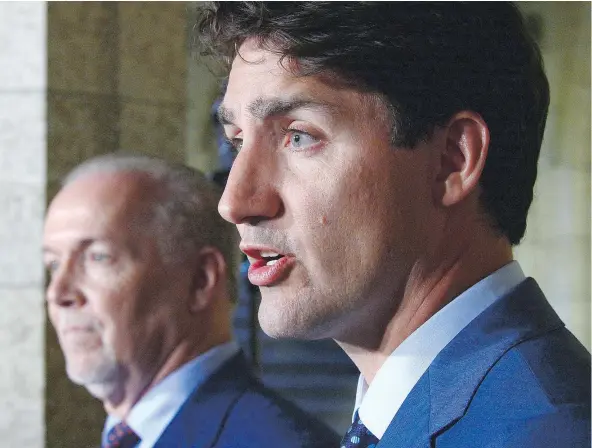  ?? — CP PHOTO ?? Prime Minister Justin Trudeau holds a press conference with B.C. Premier John Horgan following their meeting in Ottawa on Tuesday. Horgan’s decision not to address Trans Mountain hints at a growing reluctance to fight the project, writes John Ivison.