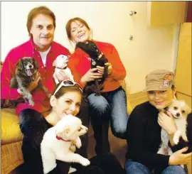  ?? LAURA ODA — STAFF ARCHIVE ?? Tony and Elaine La Russa, top, with their daughters Devon, left, and Bianca, right, and their dogs at their Animal Rescue Foundation headquarte­rs in Walnut Creek in 2008.