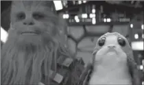  ?? DISNEY-LUCASFILM ?? "The Last Jedi" introduces the Porg, right, with Chewbacca.