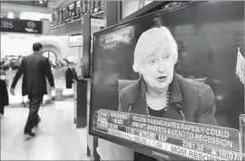  ?? Richard Drew Associated Press ?? FED CHAIRWOMAN Janet L. Yellen’s news conference on TV at the New York Stock Exchange. “We have confidence in the robustness of the economy,” she said.