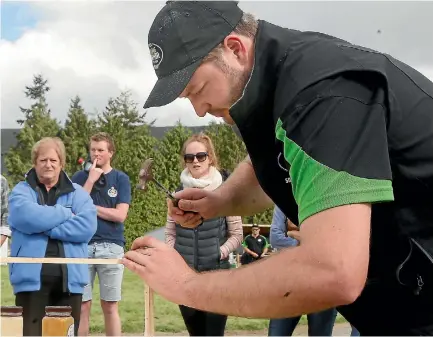  ?? PHOTO: JOHN BISSET/STUFF ?? Cameron Black competes in the Aorangi regional final of the FMG Young Farmer of the Year in Waimate on Saturday.