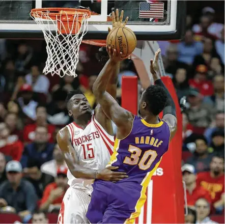  ?? Karen Warren / Houston Chronicle ?? Despite a game-high 32 points by the Lakers’ Julius Randle, Clint Capela, left, and his Rockets teammates had Wednesday night’s game under control most of the way at Toyota Center, using a 46-point fourth quarter as an exclamatio­n point.