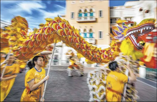  ?? L.E. Baskow Las Vegas Review-Journal @Left_Eye_Images ?? Dancers from the Yau Kung Moon dance troupe in San Francisco celebrate the Lunar New Year outside The Venetian on Saturday.