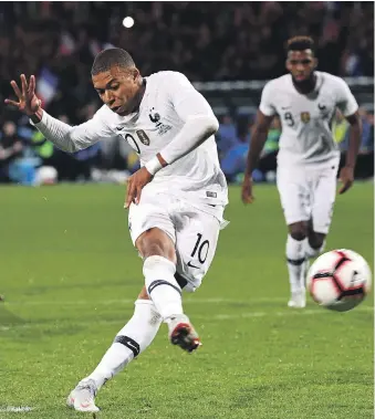  ?? AFP ?? Kylian Mbappe scores a 90th-minute penalty after coming off the bench to help earn France a draw in the friendly internatio­nal against Iceland in Guingamp last week